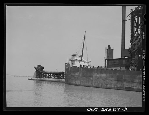 Untitled photo, possibly related to: Sandusky, Ohio. Loading coal into a freighter at one of the Pennsylvania Railroad docks