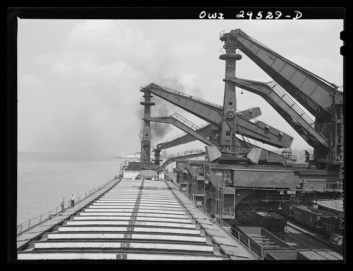 Cleveland, Ohio. Unloading a lake freighter by means of Hewlett [i.e., Hulett] unloaders at the Pennsylvania Railroad iron ore docks