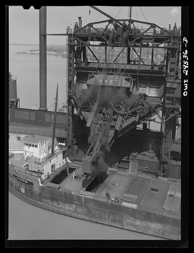 Untitled photo, possibly related to: Sandusky, Ohio. Loading coal into a lake freighter at the Pennsylvania Railroad docks