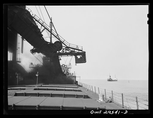 Sandusky, Ohio. Loading coal from the Pennsylvania Railroad docks into a lake freighter. In the distance, a boat that has just been loaded is leaving port