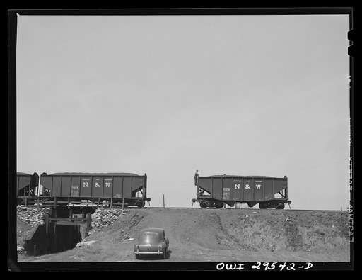 Carload of coal going over the hump at the classification yard where trains of cars are made up to go to the docks