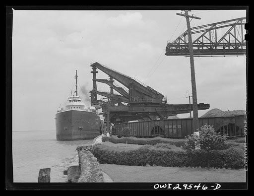 Cleveland, Ohio. Unloading a lake freighter by means of Hewlett [i.e., Hulett] unloaders at the Pennsylvania Railroad iron ore docks