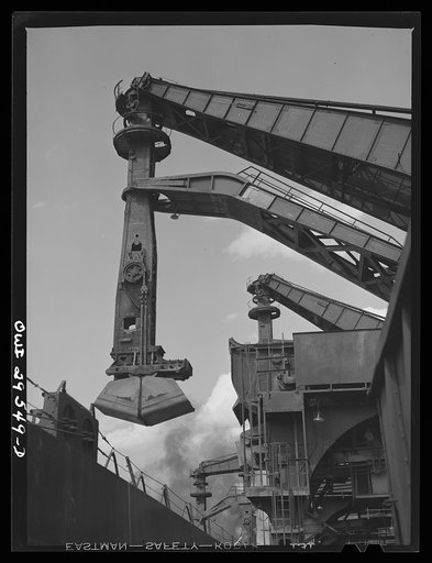 Cleveland, Ohio. Unloading a lake freighter by means of Hewlett [i.e., Hulett] unloaders at the Pennsylvania Railroad iron ore docks