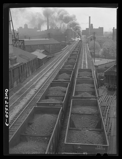 Cleveland, Ohio. A trainlaod of iron ore leaving the Pennsylvania Railroad docks for the steel mills