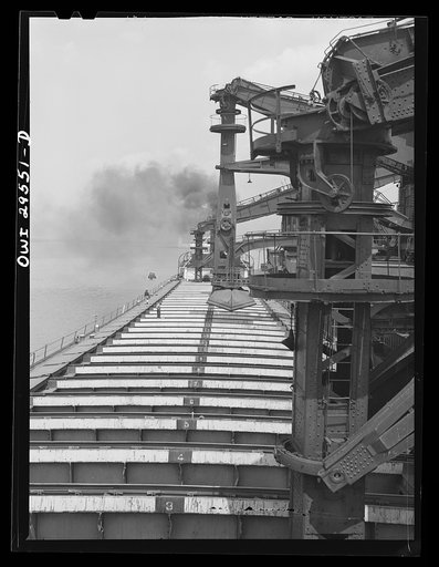 Cleveland, Ohio. Unloading a lake freighter by means of Hewlett [i.e., Hulett] unloaders at the Pennsylvania Railroad iron ore docks