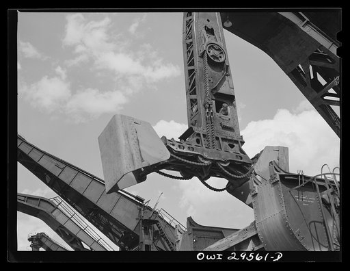 Cleveland, Ohio. Unloading a lake freighter by means of Hewlett [i.e., Hulett] unloaders at the Pennsylvania Railroad iron ore docks