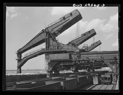 Cleveland, Ohio. Unloading a lake freighter by means of Hewlett [i.e., Hulett] unloaders at the Pennsylvania Railroad iron ore docks