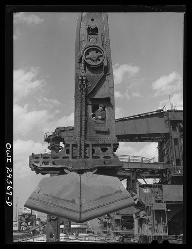 Cleveland, Ohio. Unloading a lake freighter by means of Hewlett [i.e., Hulett] unloaders at the Pennsylvania Railroad iron ore docks