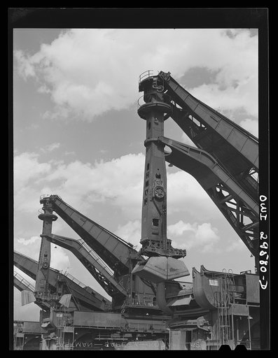Cleveland, Ohio. Unloading a lake freighter by means of Hewlett [i.e., Hulett] unloaders at the Pennsylvania Railroad iron ore docks