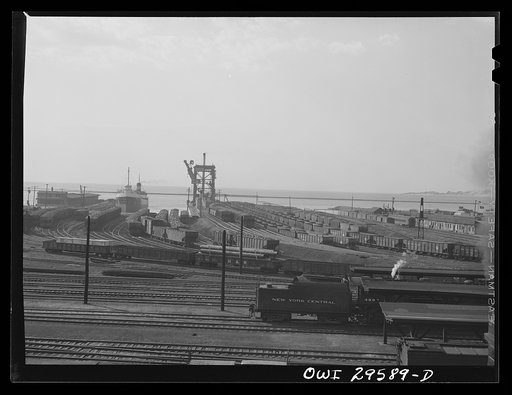 Untitled photo, possibly related to: Cleveland, Ohio. Trainloads of coal at the Pennsylvania Railroad docks waiting to be loaded into freighters for shipment to other lake ports