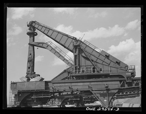 Untitled photo, possibly related to: Cleveland, Ohio, Unloading a lake freighter at the Pennsylvania Railroad iron ore docks by means of Hewlett [i.e., Hulett] unloaders to pick up their loads