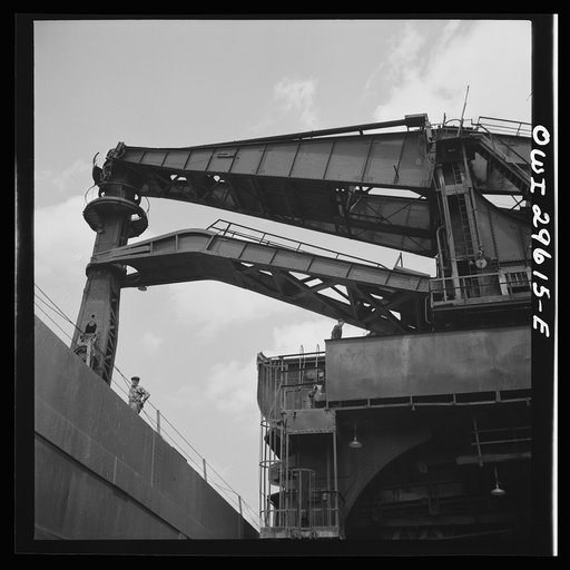 Cleveland, Ohio. Unloading iron ore from a lake freighter by means of Hewlett [i.e., Hulett] unloaders at the Pennsylvania Railroad docks