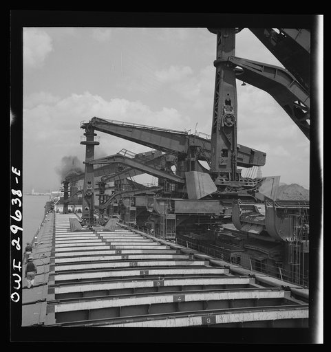 Cleveland, Ohio. Unloading iron ore from a lake freighter by means of Hewlett [i.e., Hulett] unloaders at the Pennsylvania Railroad docks