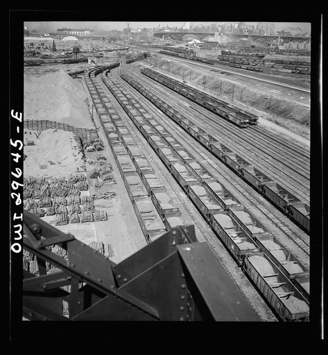 Cleveland, Ohio. On the right, empty cars waiting to be loaded at the Pennsylvania Railroad docks; on the left, loaded cars ready to be sent to the steel mills