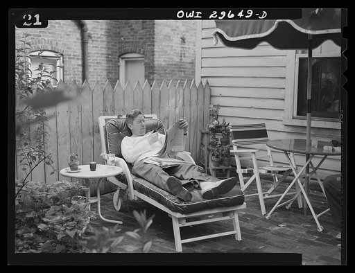 Untitled photo, possibly related to: Alexandria, Virginia. Father and son reading the Sunday newspaper. Scenes similar to this are found all over the United States because of wartime transportation problems