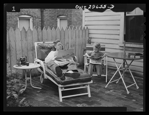 Untitled photo, possibly related to: Alexandria, Virginia. Father and son talking on a Sunday afternoon. Scenes similar to this are found all over the United States because of wartime transportation problems