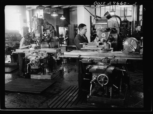 Melbourne, Australia. Beaufort torpedo bomber turret sub-assembly plant. Workmen operating an automatic tool machine. Ninety-five per cent of the machinery in this plant was imported under the lend lease program