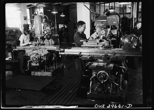 Untitled photo, possibly related to: Melbourne, Australia. Beaufort torpedo bomber turret sub-assembly plant. Workmen operating an automatic tool machine. Ninety-five per cent of the machinery in this plant was imported under the lend lease program