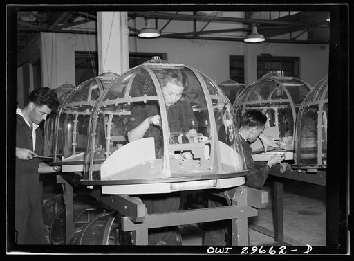 Melbourne, Australia. Beaufort torpedo bomber turret sub-assembly plant. Men and women workmen putting finishing touches on turrets. All the transparent lucite and metal reinforcement strips used in these turrets were imported under the lend lease program
