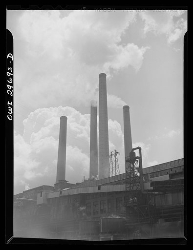Institute (vicinity), West Virginia. The stacks of a chemical factory, seen from the Kanawha River
