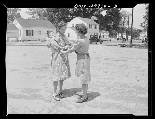 Point Pleasant, West Virginia. Mrs. Fergusen and a neighbor discussing a homemade dress