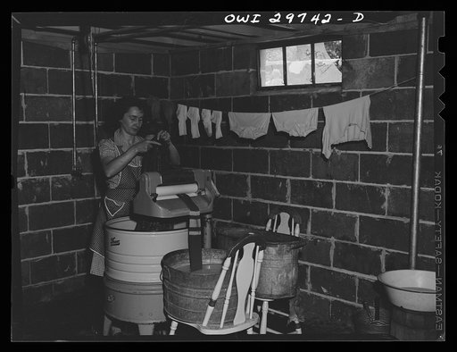 Untitled photo, possibly related to: Point Pleasant, West Virginia. Mrs. Fergusen wringing out clothes