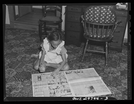 Point Pleasant, West Virginia. Ann Fergusen reading the comics