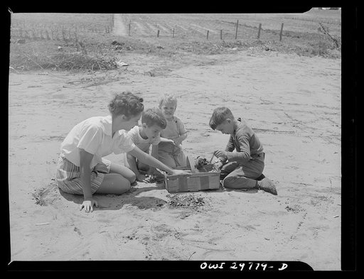 Point Pleasant (vicinity), West Virginia. Children playing with puppy