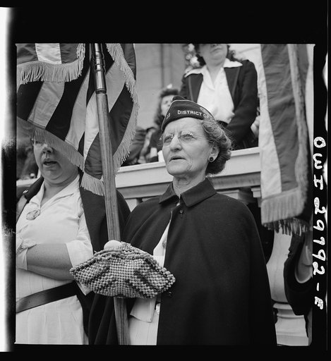 Arlington Cemetery, Arlington, Virginia. American Legion color bearer during the singing of "America" at the Memorial Day services in the amphitheater