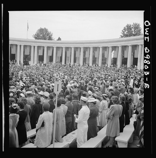 Arlington Cemetery, Arlington, Virginia. Spectators rising to sing the "Star Spangled Banner" at the Memorial Day services in the amphitheater