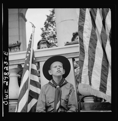 Arlington Cemetery, Arlington, Virginia. Boy scout color bearer listening to the Memorial Day ceremony