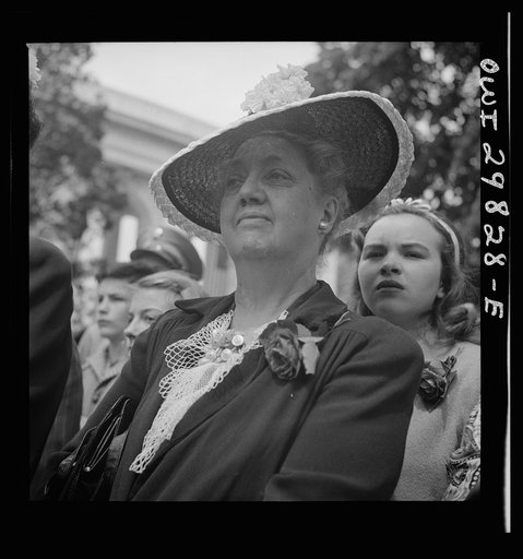 Untitled photo, possibly related to: Arlington Cemetery, Arlington, Virginia. A girl watching Colonel Hammond lay the President's wreath on the Tomb of the Unknown Soldier on Memorial Day