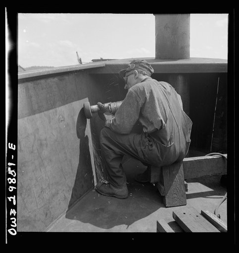 Point Pleasant, West Virginia. Burring operation on an LT boat at the Marietta Manufacturing Company