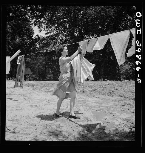 Point Pleasant, West Virginia. Mrs. Fergusen taking clothes off the line