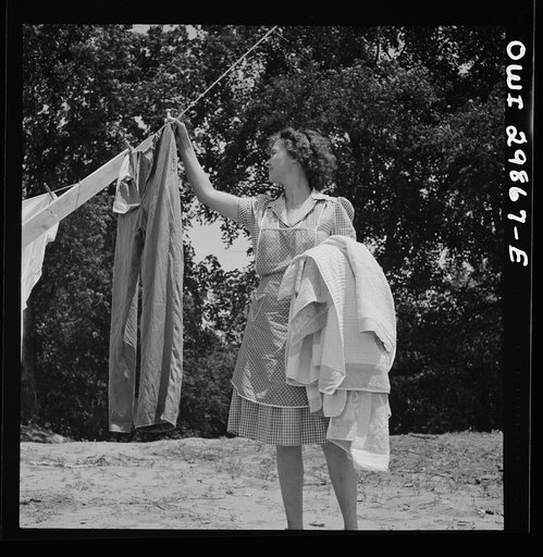 Point Pleasant, West Virginia. Mrs. Fergusen taking the clothes off the line