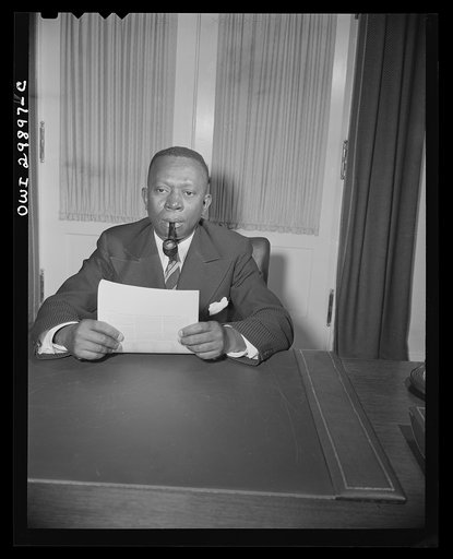Untitled photo, possibly related to: President-elect of the Republic of Liberia. The Honorable W.V.S. Tubman, President-lect of the Republic of Liberia is shown at a desk in historic Blair House during the official visit of His Excellency, Edwin Barclay, President of the Republic of Liberia on May 3