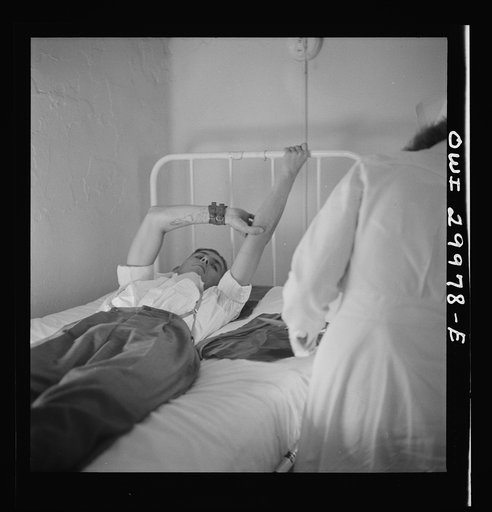 Washington, D.C. After giving blood, a donor must hold his arm in this position for a few minutes
