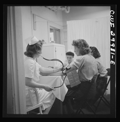 Washington, D.C. Routine health examinations are given to all volunteer blood donors at the American Red Cross center