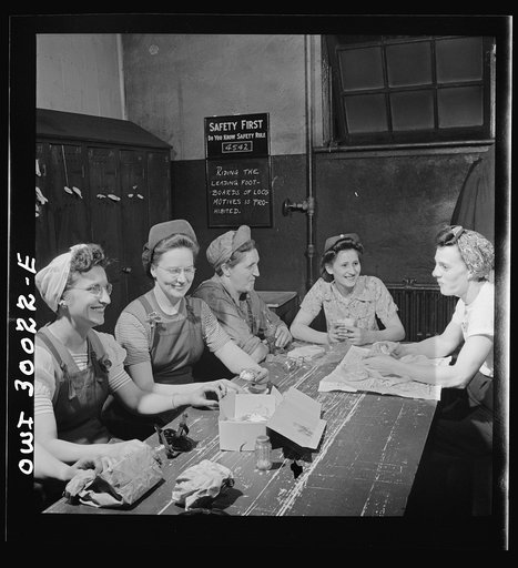 Pitcairn, Pennsylvania. Lunch hour in the women's locker at the yards of the Pennsylvania Railroad. Left to right: Bertha Carlotta, twenty-nine, a machinist testing axles; Anna Plecenik, twenty-four, a machinist's helper, working a drill press; Mary Stefanski, thirty-seven, a blacksmith's helper; Ce