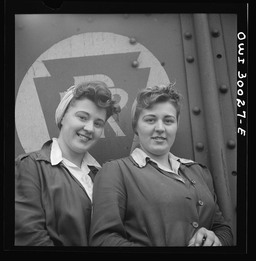 Pitcairn, Pennsylvania. Twins Amy and Mary Rose Lindich, twenty-one, employed at the Pennsylvania Railroad as car repairmen helpers, earning seventy-two cents per hour. They reside in Jeanette, Pennsylvania, and carpool with fellow workers