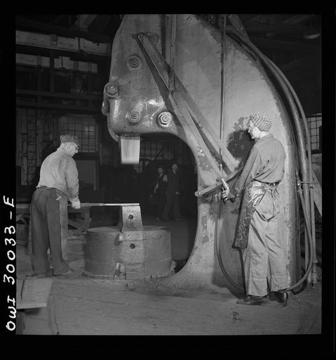 Pitcairn, Pennsylvania. Mrs. Katie Sablejack, forty-five, a Hungarian, employed as a blacksmith's helper in the Pennsylvania Railroad yards, earning seventy-two cents per hour. She is operating a half-ton steam hammer. Mrs. Sablejack is a widow and mother of two children