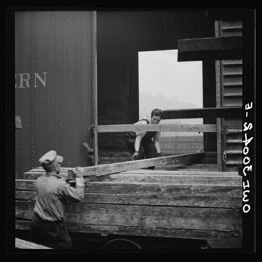 Untitled photo, possibly related to: Pitcairn, Pennsylvania. Mrs. Lois Micheltree, thirty-six, employed as a laborer at the Pennsylvania Railroad lumber yard, earning fifty-five cents per hour. She helps to load and unload lumber from cars. Mrs. Micheltree has a son in the United States Navy