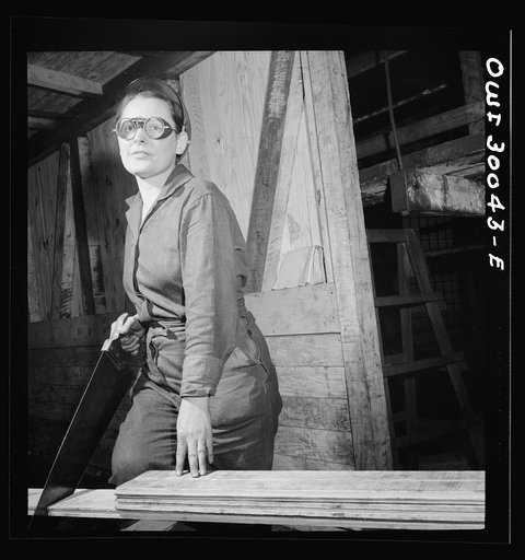 Untitled photo, possibly related to: Pitcairn, Pennsylvania. Mrs. Hazel Reed, thirty, employed as a car repairman's helper in the Pennsylvania Railroad yards, earning seventy-two cents per hour. She is repairing a wooden boxcar. Mrs. Reed's husband is in the United States Army