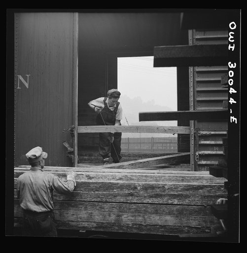 Untitled photo, possibly related to: Pitcairn, Pennsylvania. Mrs. Lois Micheltree, thirty-six, employed as a laborer at the Pennsylvania Railroad lumber yard, earning fifty-five cents per hour. She helps to load and unload lumber from cars. Mrs. Micheltree has a son in the United States Navy