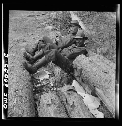 Spring pulpwood drive on the Brown Company timber holdings in Maine. Woodsman relaxing after lunch