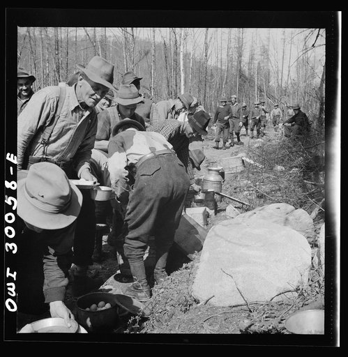 Spring pulpwood drive on the Brown Company timber holdings in Maine. At ten o'clock and two o'clock woodsmen eat near their work, serving themselves cafeteria style