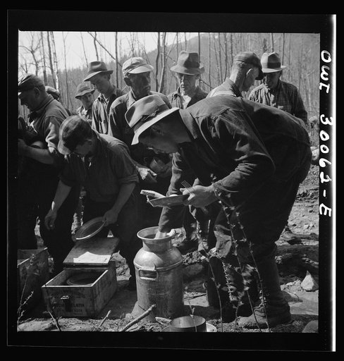 Spring pulpwood drive on the Brown Company timber holdings in Maine. At ten o'clock and two o'clock woodsmen sat near their work, serving themselves cafeteria style