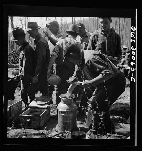 Untitled photo, possibly related to: Spring pulpwood drive on the Brown Company timber holdings in Maine. At ten o'clock and two o'clock woodsmen sat near their work, serving themselves cafeteria style