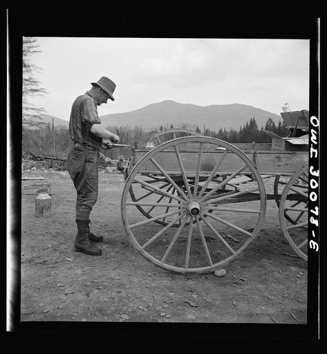 Untitled photo, possibly related to: Spring pulpwood drive on the Brown Company timber holdings in Maine. Mid-afternoon lunch brought by wagon from camp to where the men are cooking