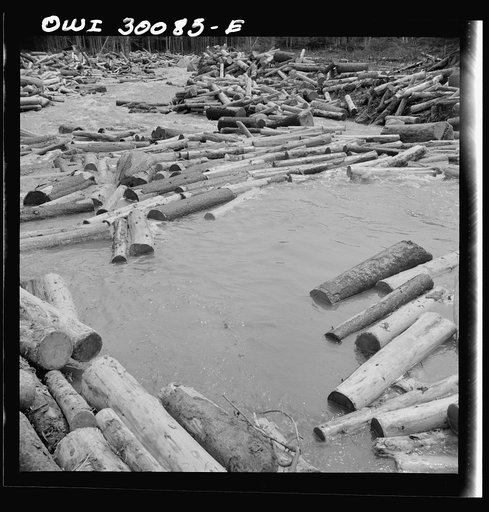 Spring pulpwood drive on the Brown Company timber holdings in Maine. A jam is forming here where a few logs were snagged on a rock